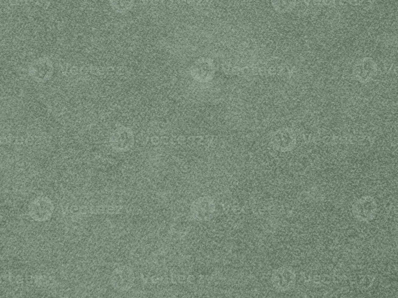 textura de tecido de veludo de cor verde oliva usada como plano de fundo. fundo de tecido verde-oliva claro de material têxtil macio e liso. há espaço para o texto. foto