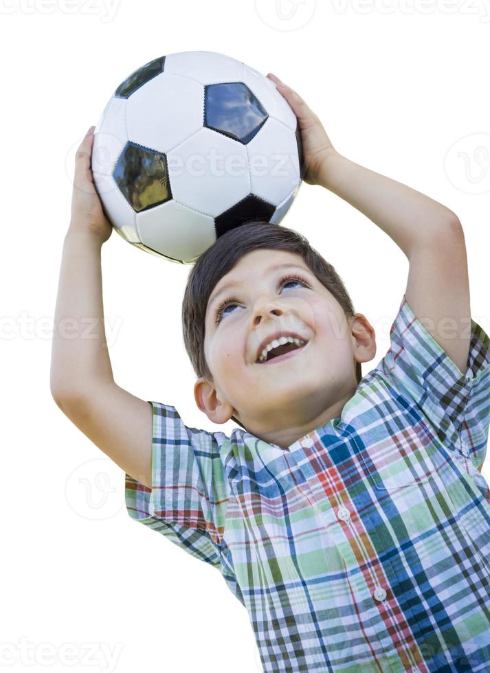 menino bonito segurando uma bola de futebol isolada no branco foto