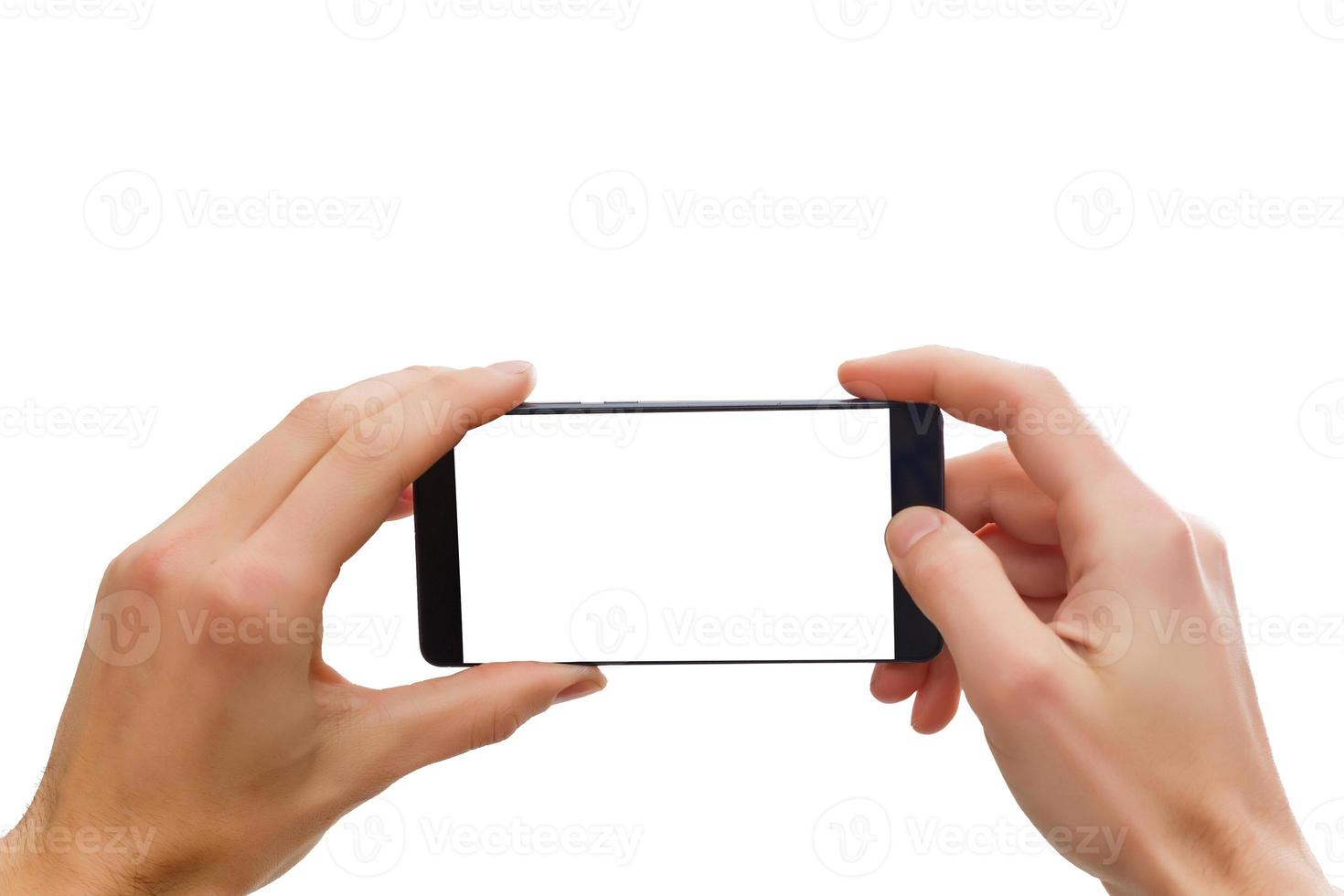 telefone na mão humana segurando o telefone inteligente móvel em branco isolado no fundo branco com traçado de recorte para a tela foto