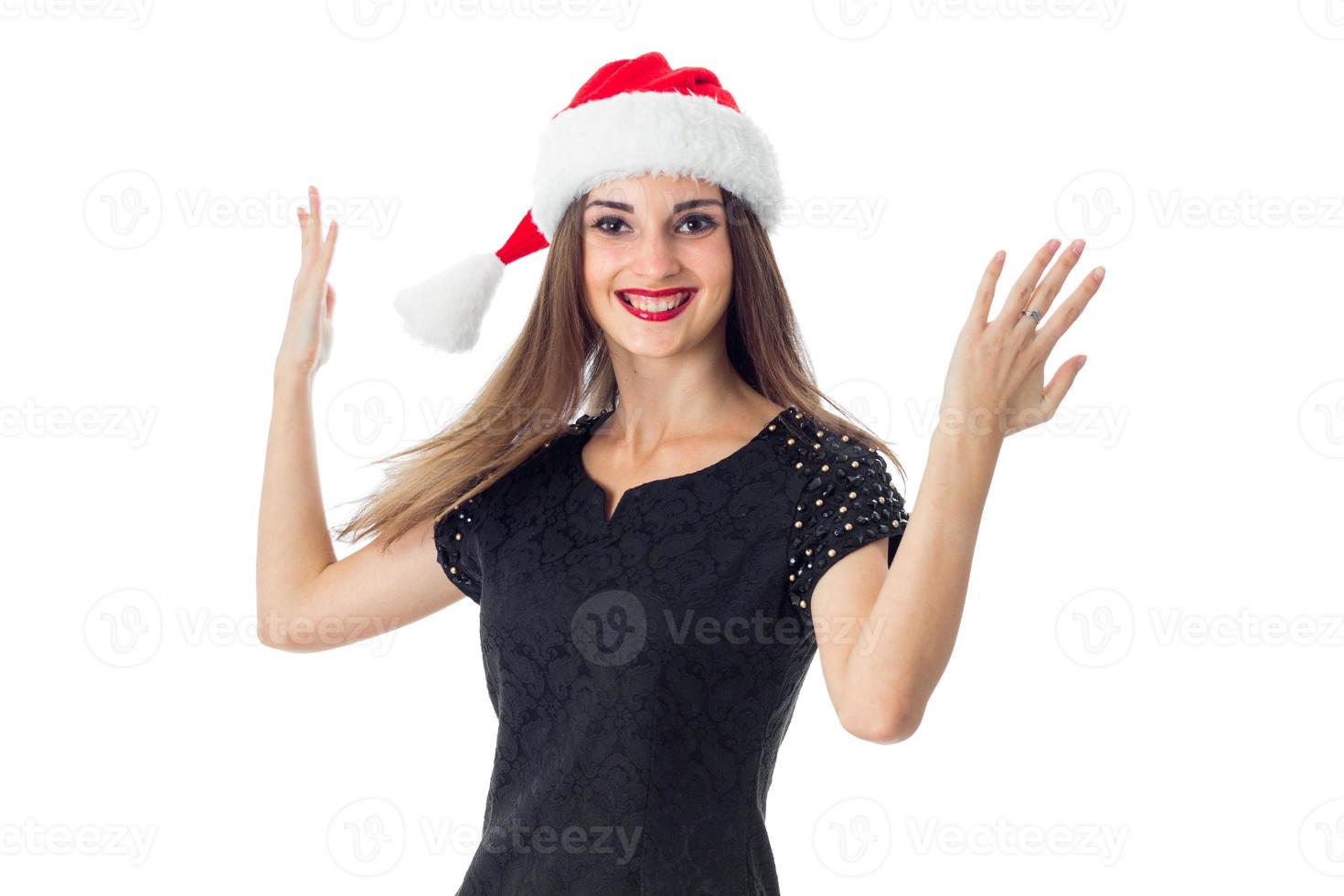 garota feliz com chapéu de Papai Noel foto