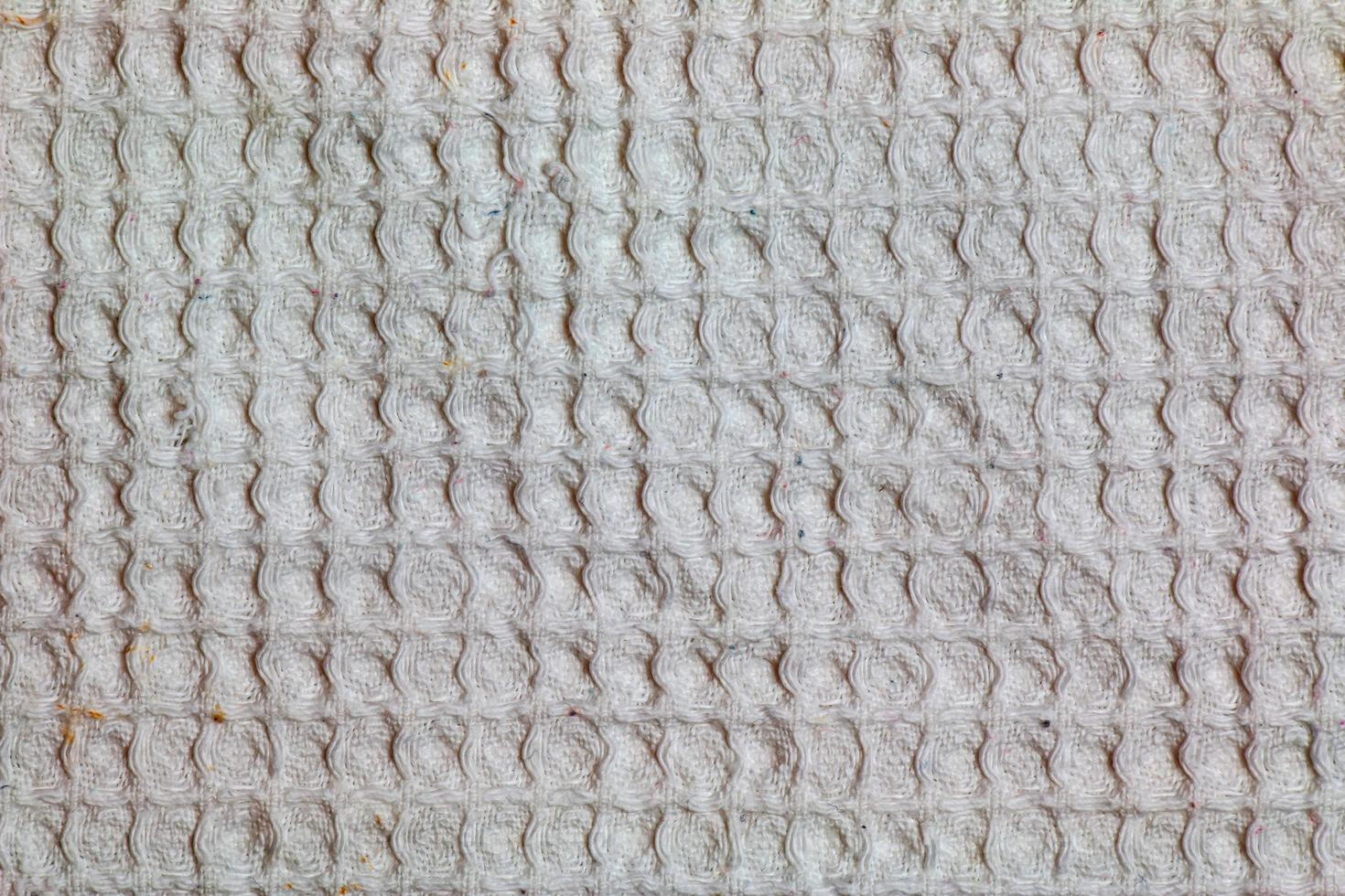 textura de tecido waffle de algodão branco como plano de fundo foto