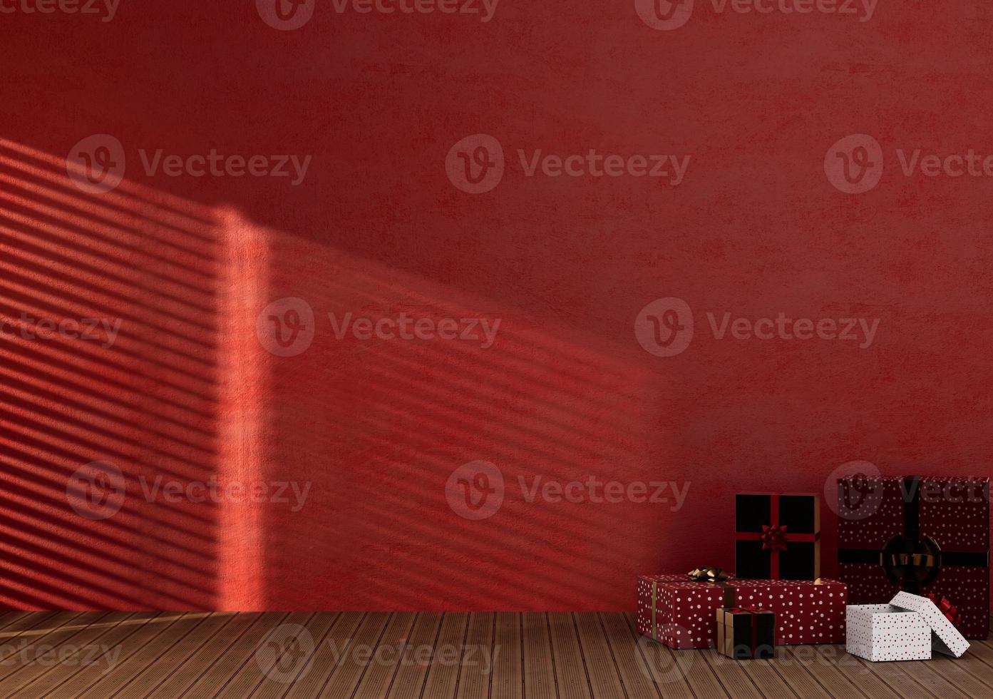 parede de cor vermelha de quarto vazio com bo de presente de natal foto