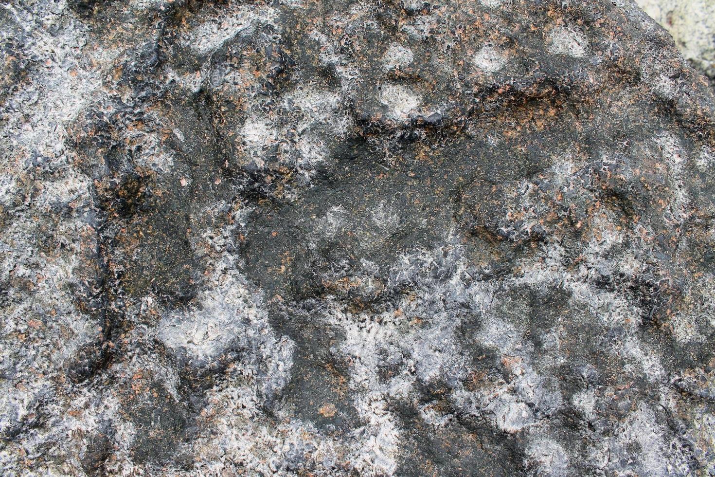 feche a vista em uma textura de granito e parede de pedra em alta resolução. foto