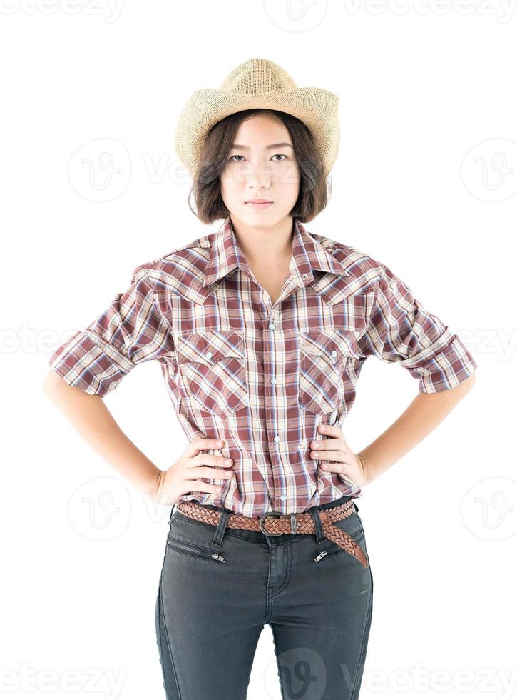 jovem com um chapéu de cowboy e camisa xadrez foto