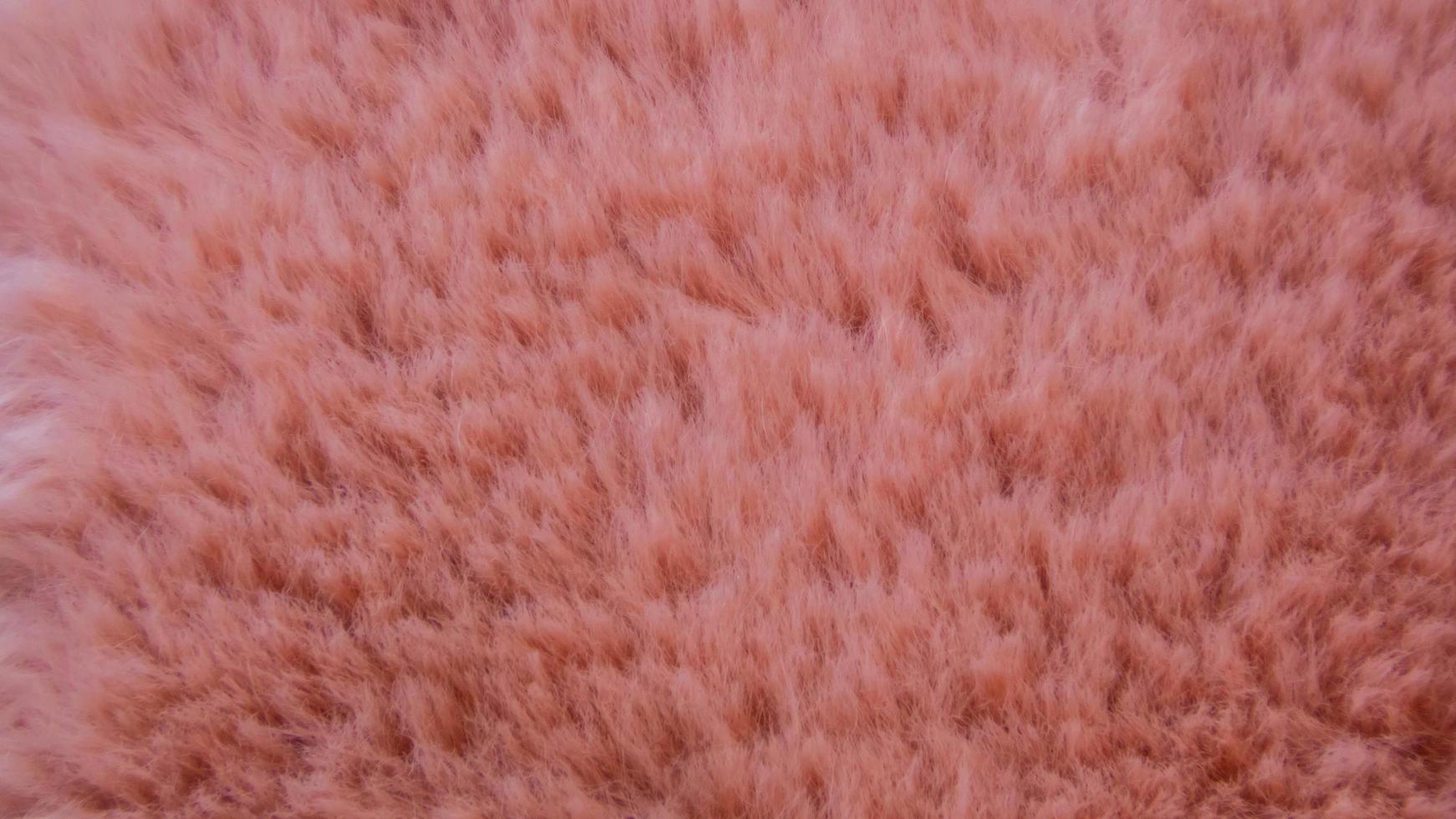 textura de lã rosa como pano de fundo foto