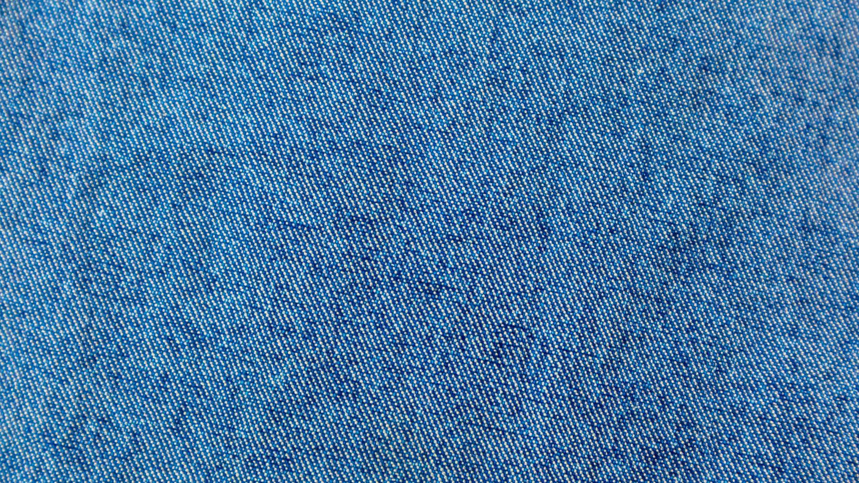 textura de jeans azul como pano de fundo foto