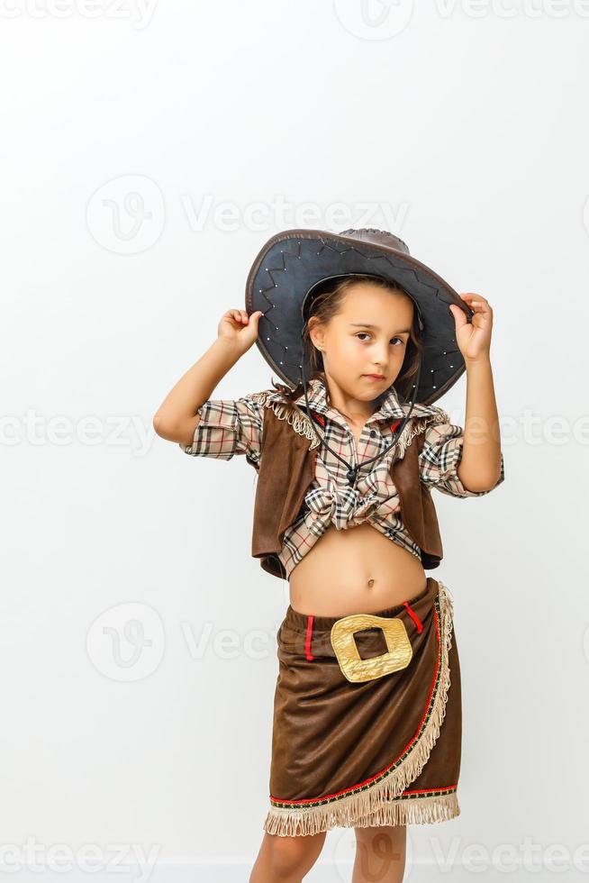 linda garotinha com chapéu de cowboy foto