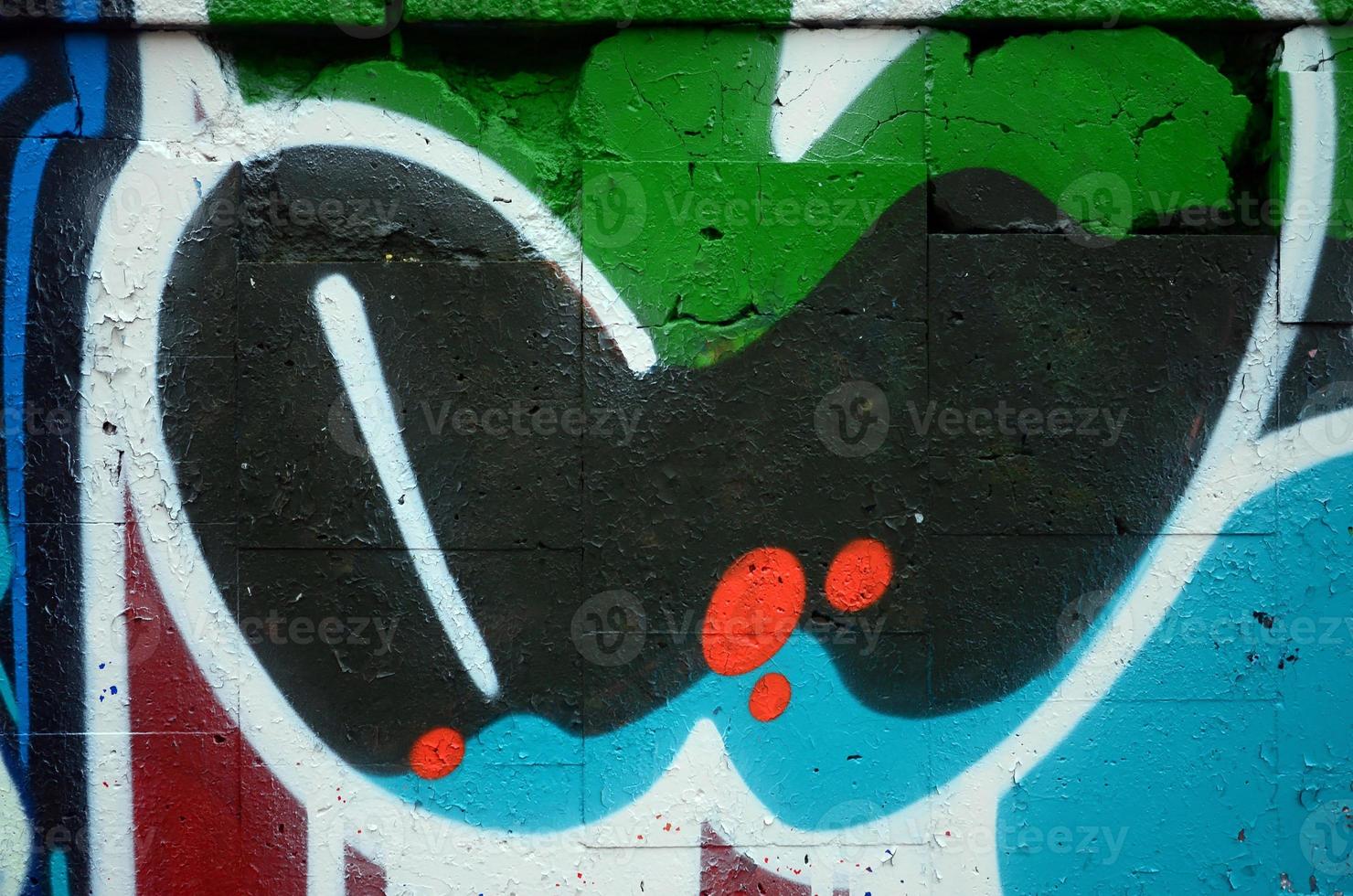 um fragmento de desenho de graffiti com contornos, aplicado na parede com o auxílio de latas de tinta aerossol sobre as áreas de preenchimento coloridas. textura de fundo de arte de rua e vandalismo foto