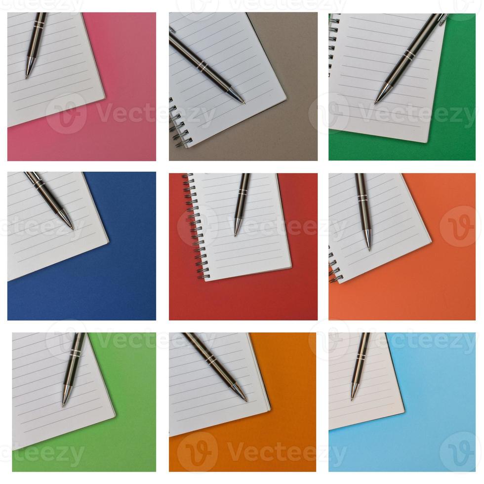 vários cadernos com caneta na página em branco foto