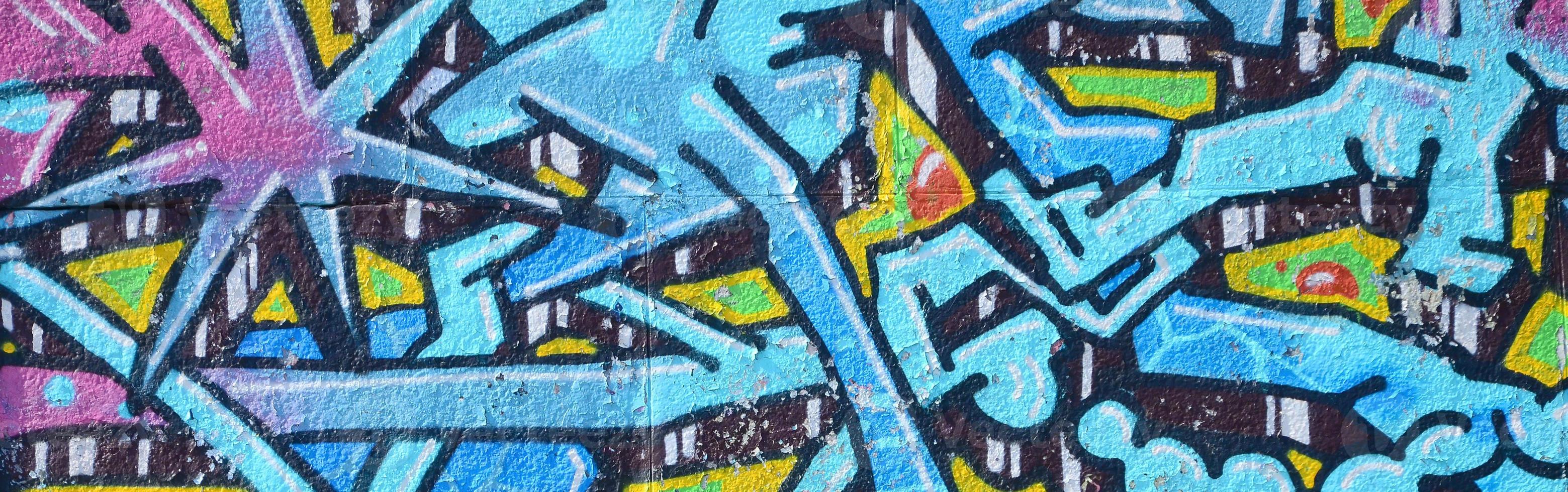 fragmento de desenhos de grafite. a velha parede decorada com manchas de tinta no estilo da cultura da arte de rua. textura de fundo colorida em tons frios foto