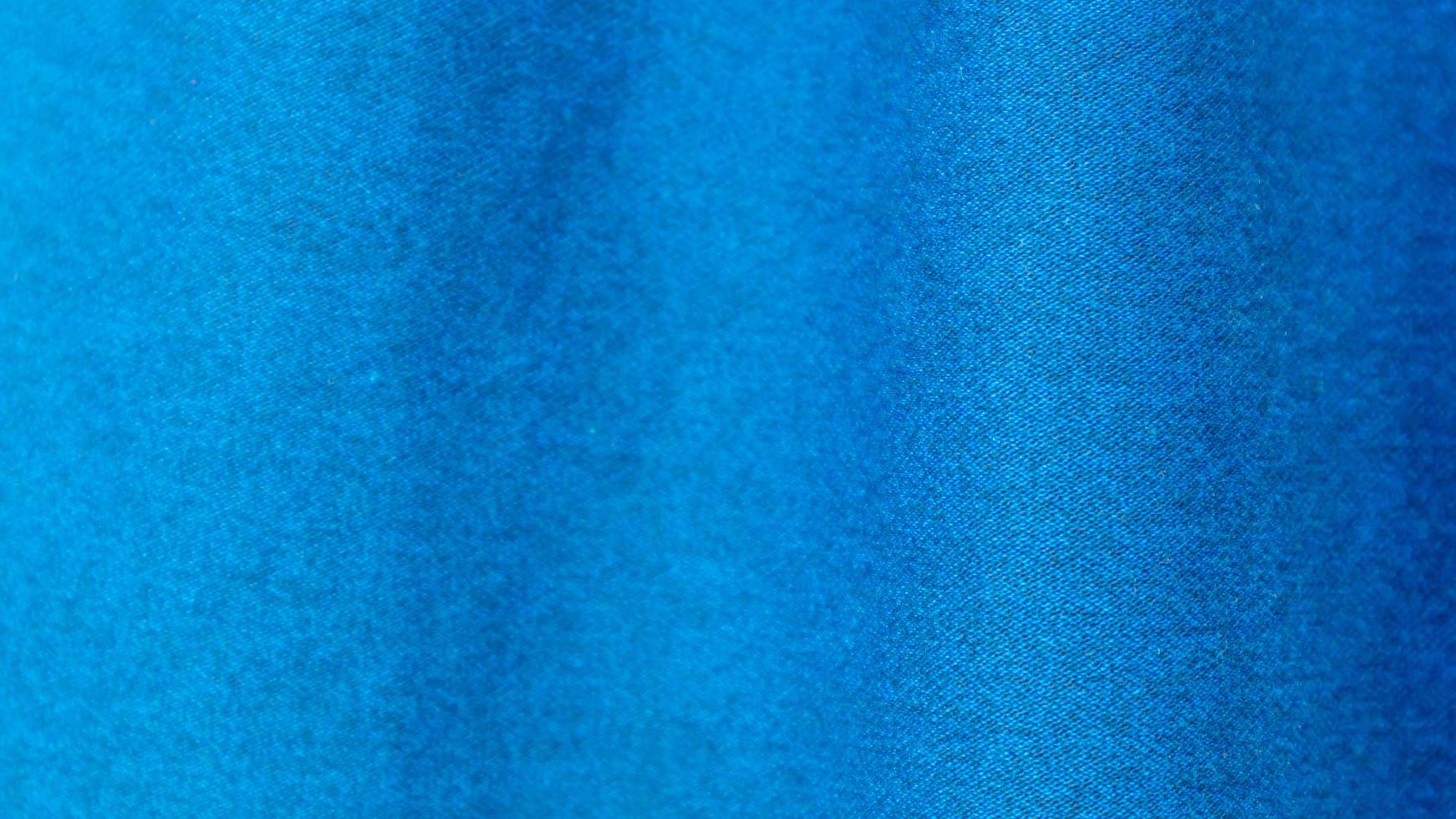 textura de pano azul como plano de fundo foto