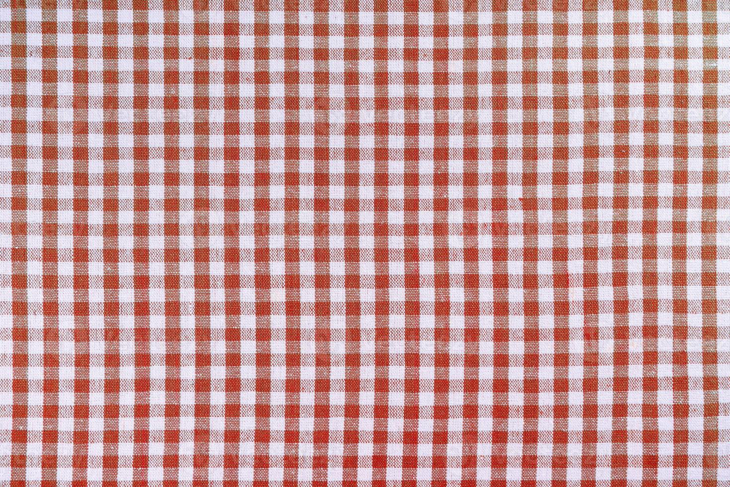 textura de toalha de mesa xadrez clássica vermelha, fundo com espaço de cópia. foto