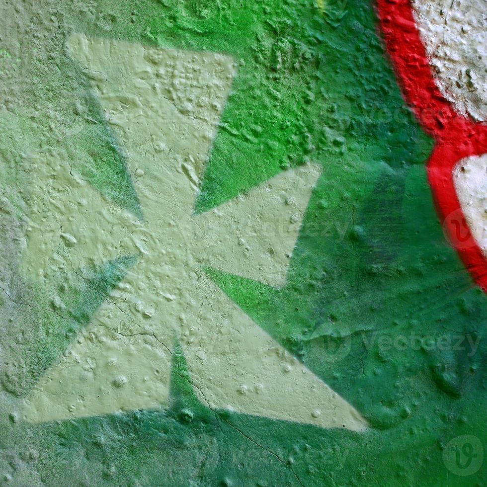 arte de rua. imagem de fundo abstrato de um fragmento de uma pintura de grafite colorido em tons cáqui verde e laranja foto