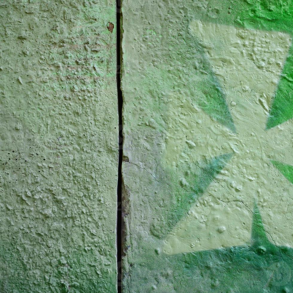 arte de rua. imagem de fundo abstrato de um fragmento de uma pintura de grafite colorido em tons cáqui verde e laranja foto