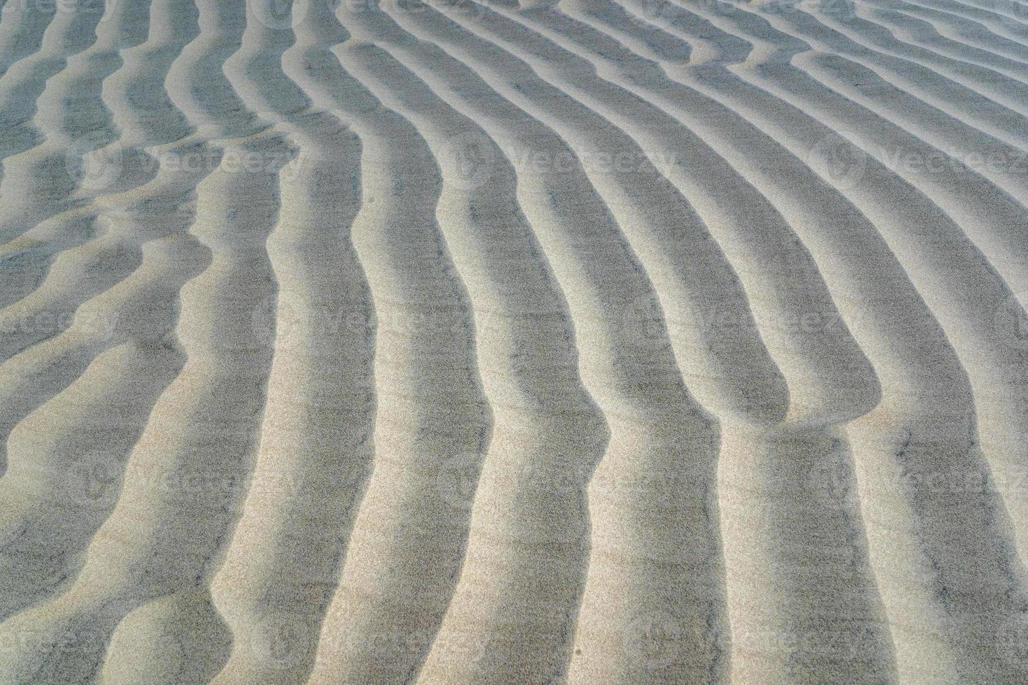 fundo de textura de obras de arte de dunas de areia do deserto foto