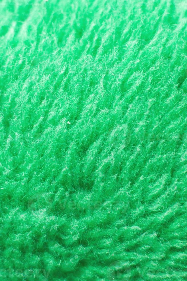 textura têxtil fofa verde. closeup de fundo peludo fralda. foto