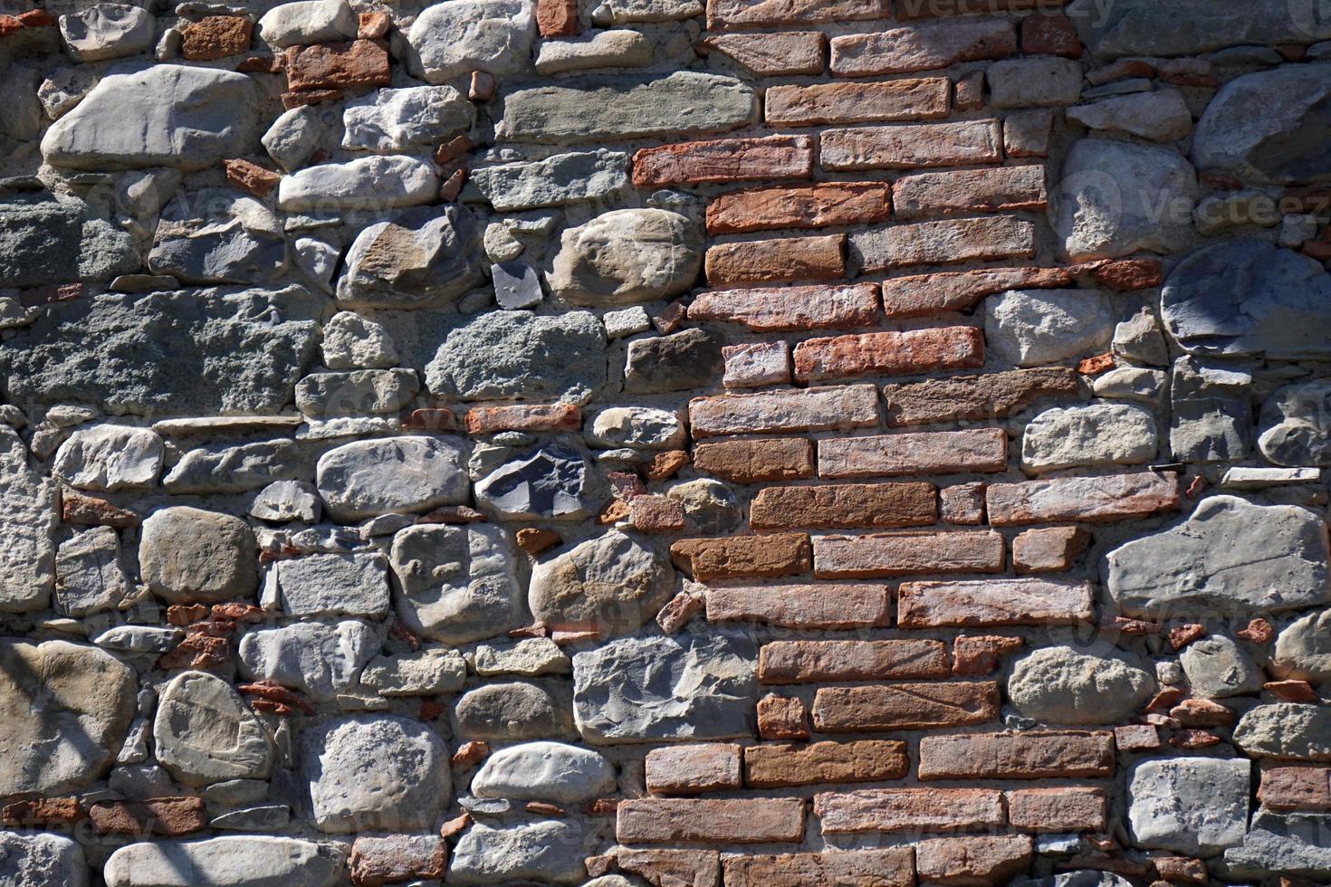 fundo de parede de pedra de casa velha foto