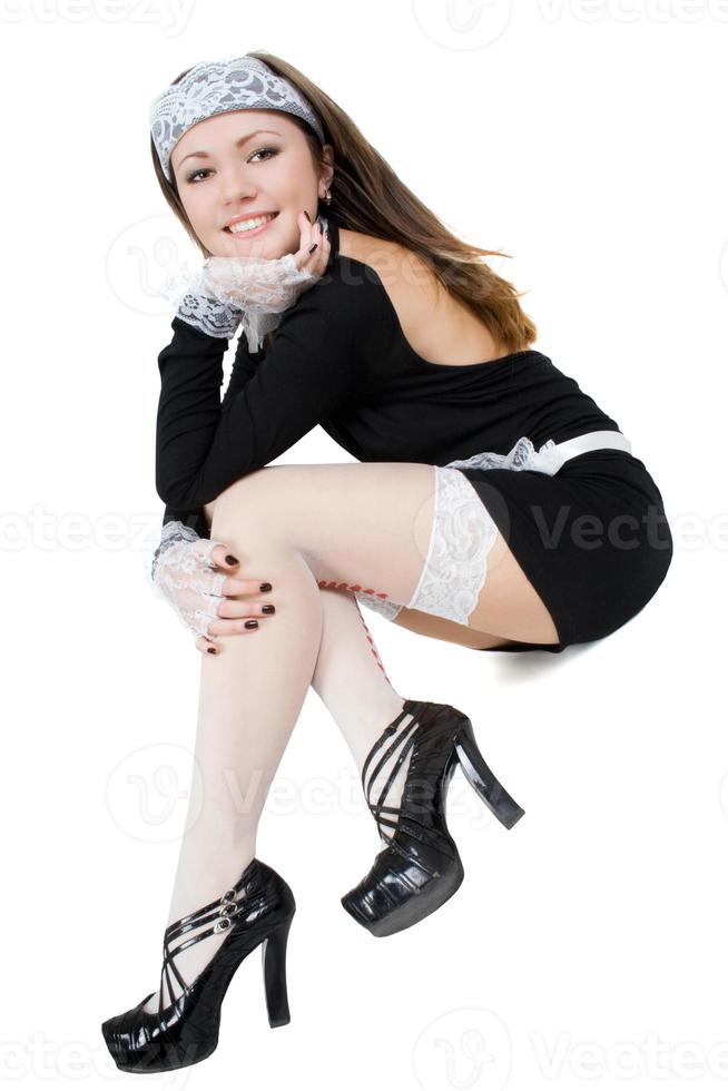 empregada jovem sexy sorridente. isolado no branco foto