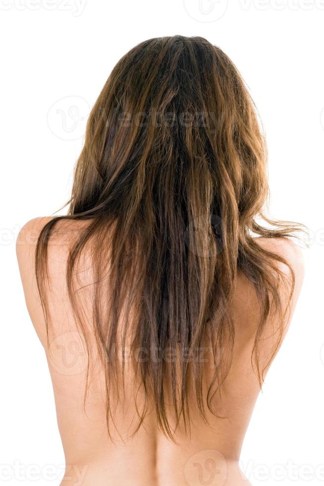 costas e cabelos longos da linda garota foto