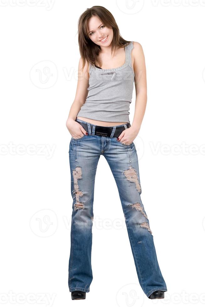 mulher jovem e bonita em um jeans azul. isolado foto