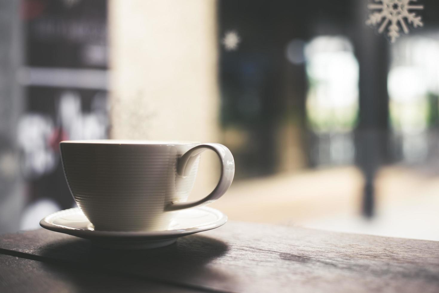 xícara de café com leite quente em tom vintage foto