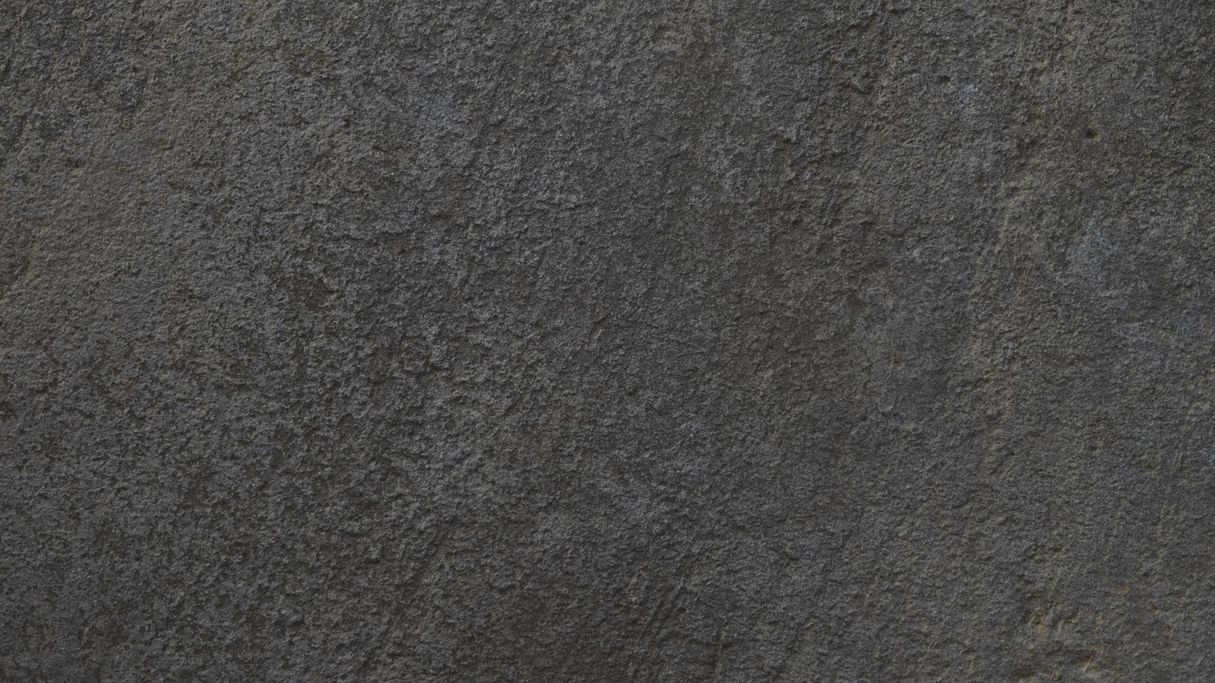 fundo de concreto cinza texturizado. parede velha ou piso feito de cimento cinza escuro. arranhado e rachado. copie o espaço. atrito. foto