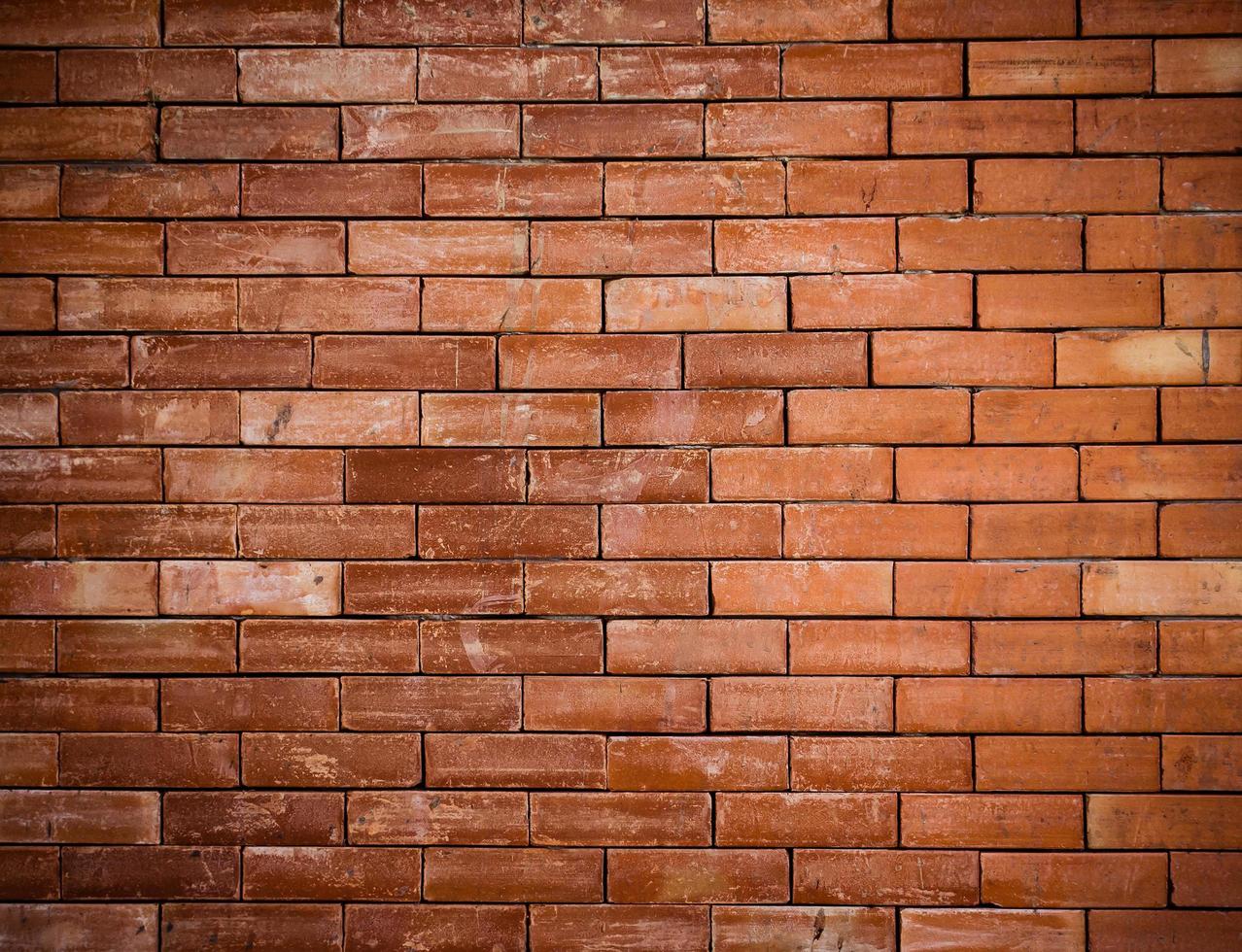 velho vermelho tijolo parede texturizado foto