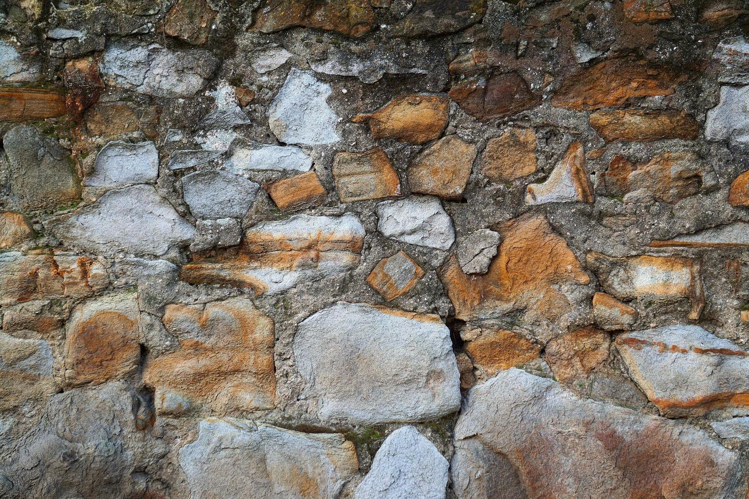 fundo texturizado de parede de pedra laranja foto