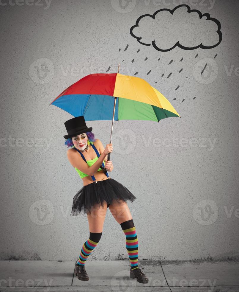 palhaços com arco Iris guarda-chuva foto