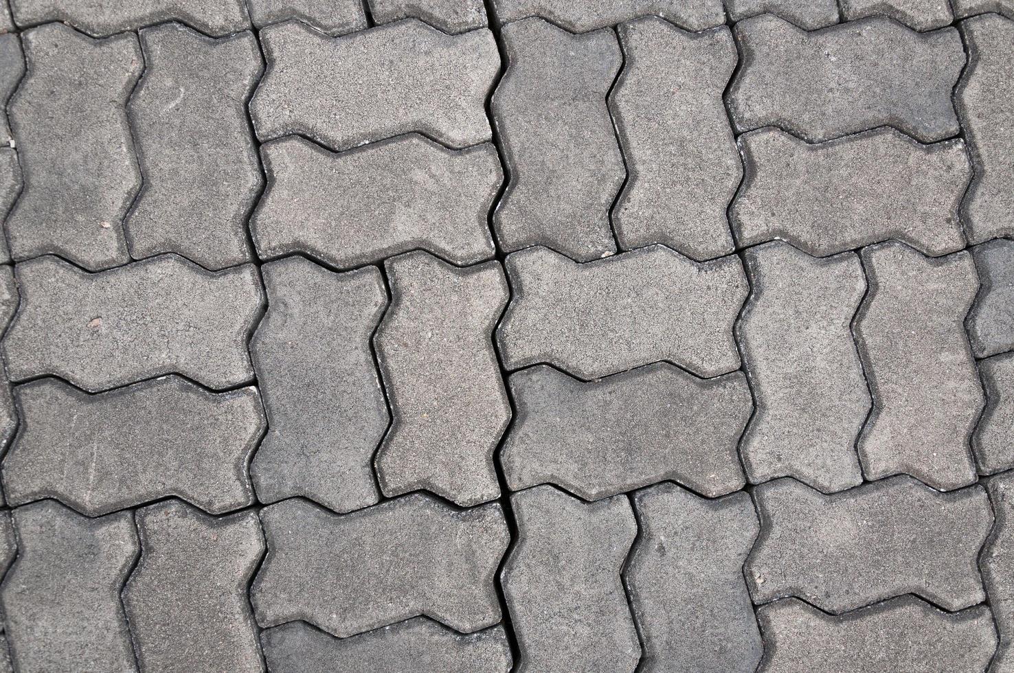 calçada portuguesa fundo, pedra pavimentação textura. abstrato calçada fundo foto