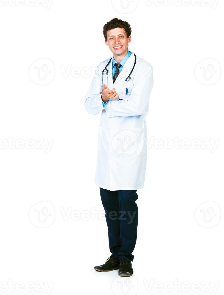 cheio comprimento retrato do a sorridente médico em pé em uma branco foto