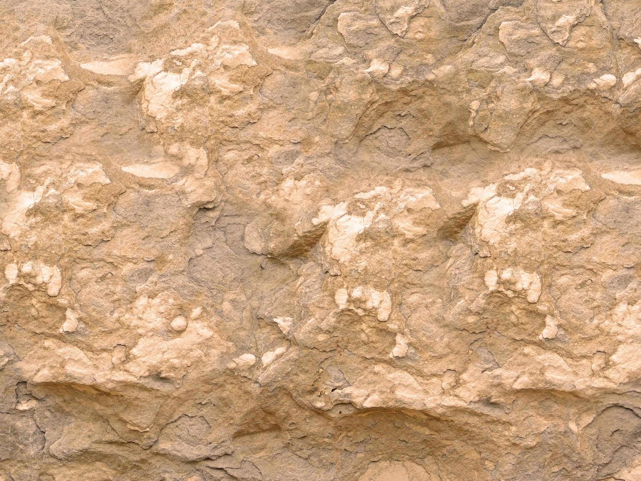 rocha ou parede de pedra para plano de fundo ou textura foto