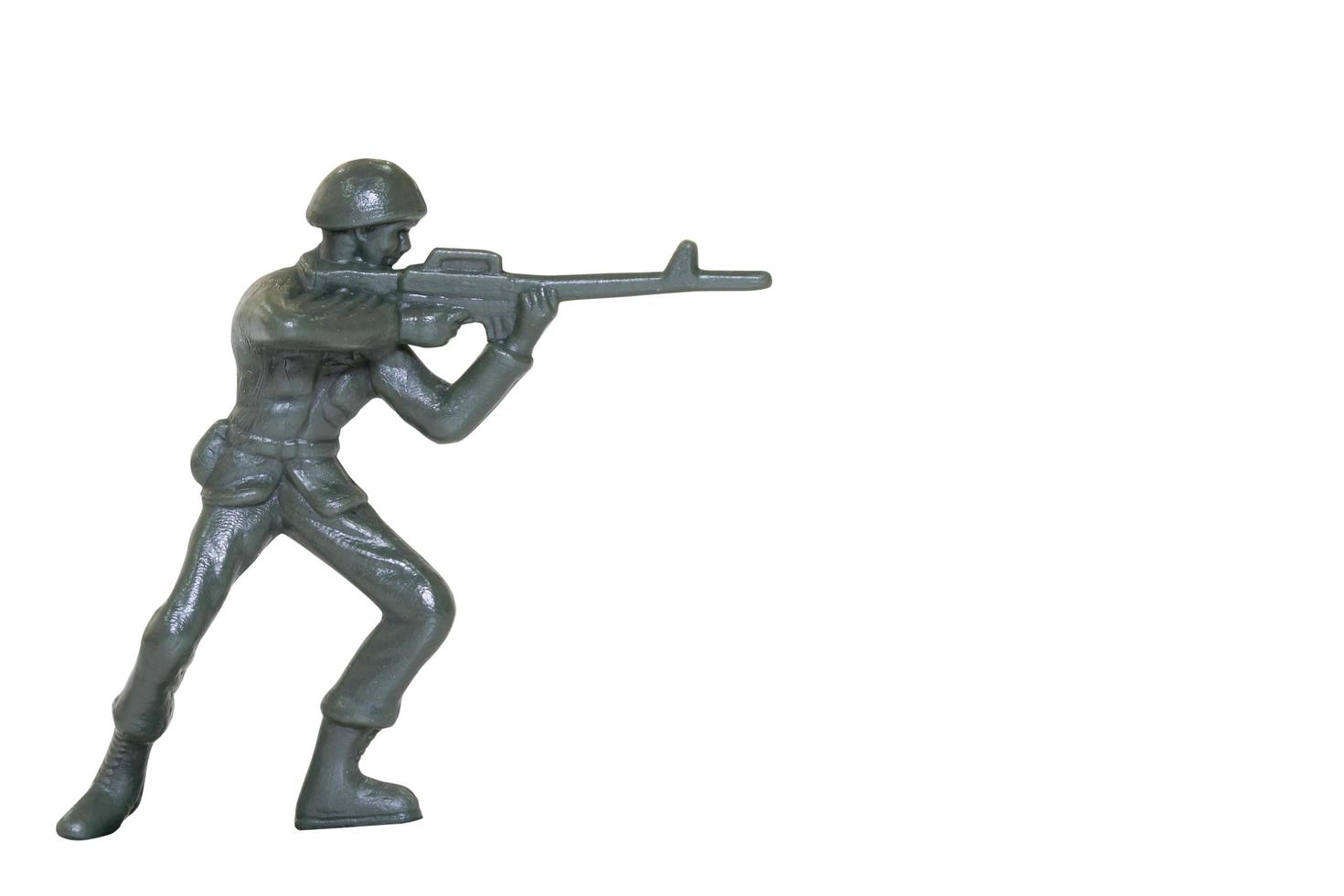 Soldado de brinquedo em miniatura em um fundo branco foto