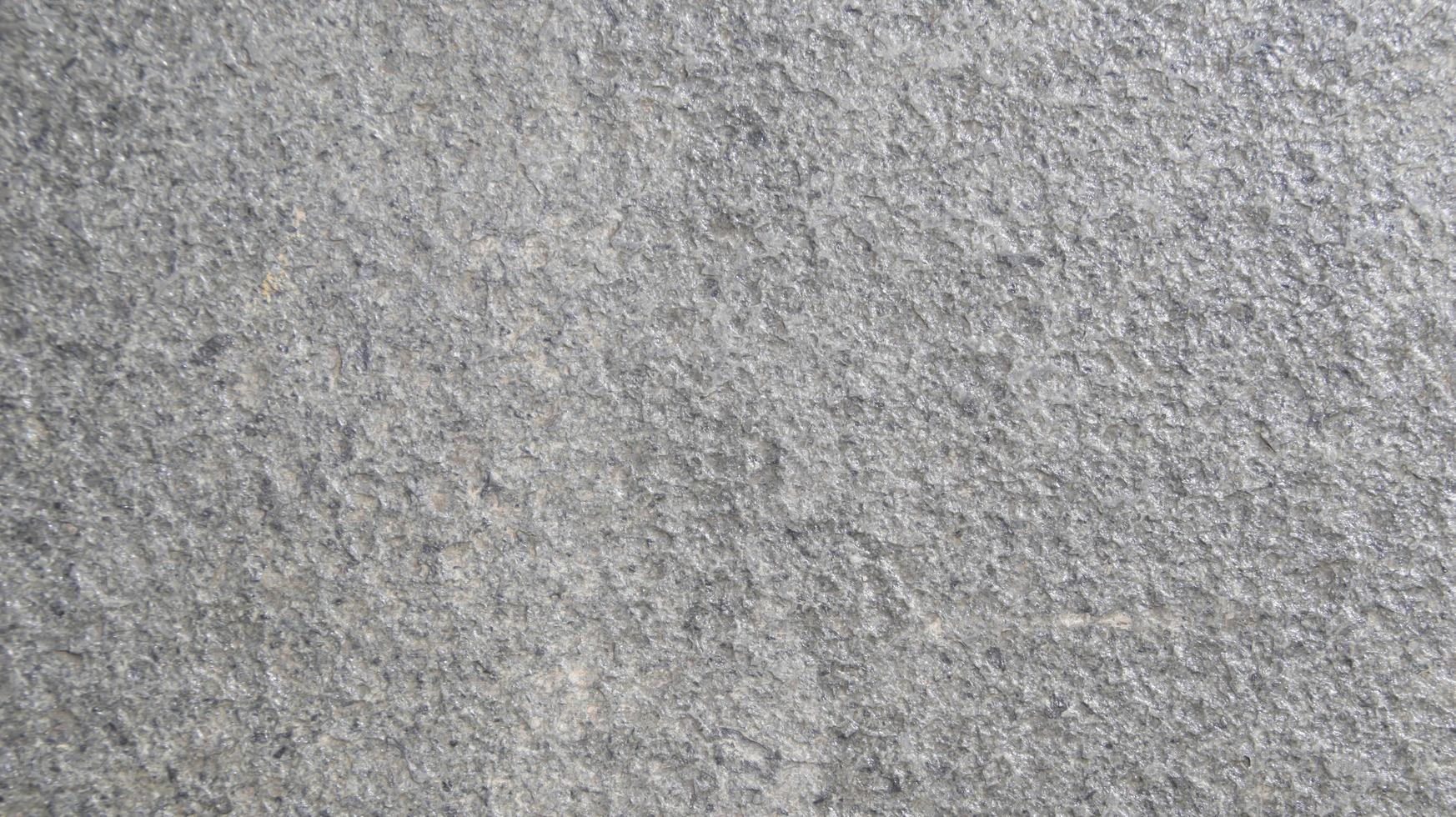fechar acima macro Visão do rude cinzento pedra superfície. detalhado natureza fundo ou padronizar textura ocupado dentro natural ambiente. foto