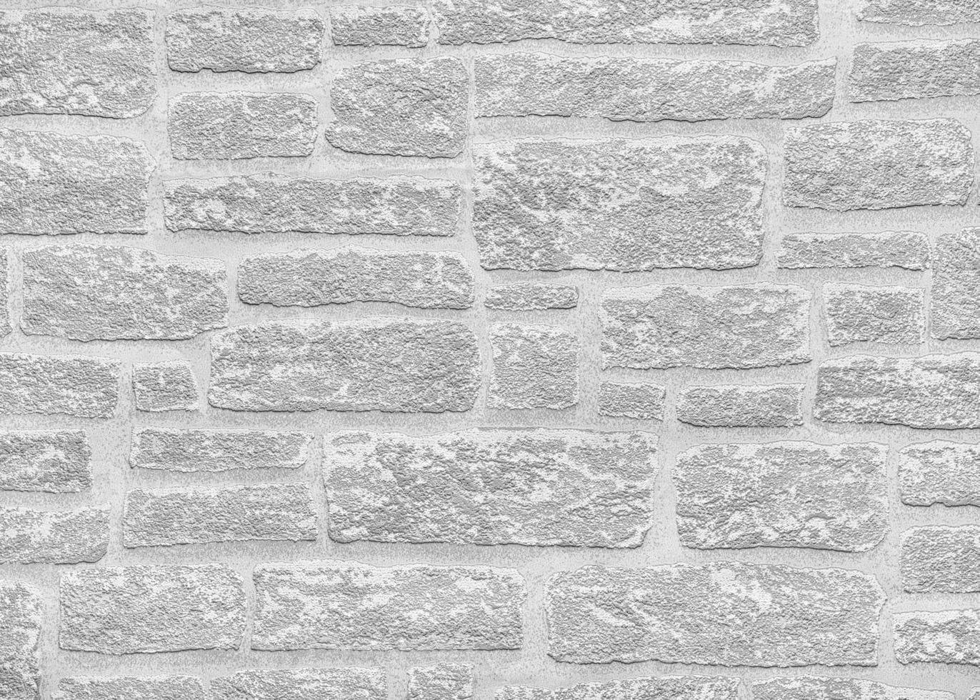 cinzento papel papel de parede com uma denso tijolo parede textura. foto