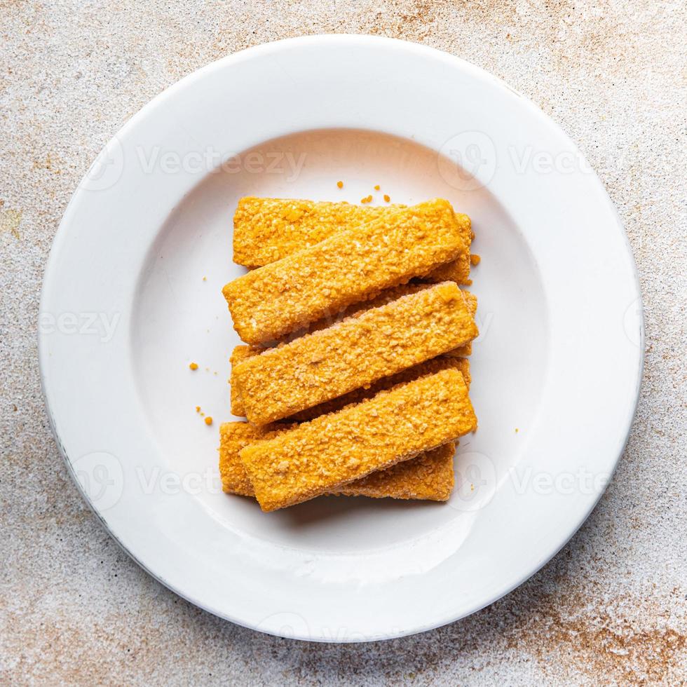 peixe bastão frito frutos do mar Migalhas de pão velozes Comida refeição Comida lanche em a mesa cópia de espaço Comida fundo rústico topo Visão foto