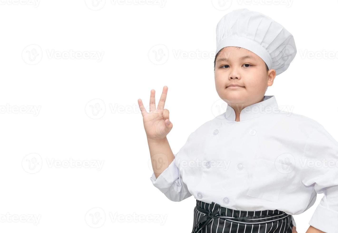 gordo Garoto chefe de cozinha cozinhar mostrando Está bem placa foto