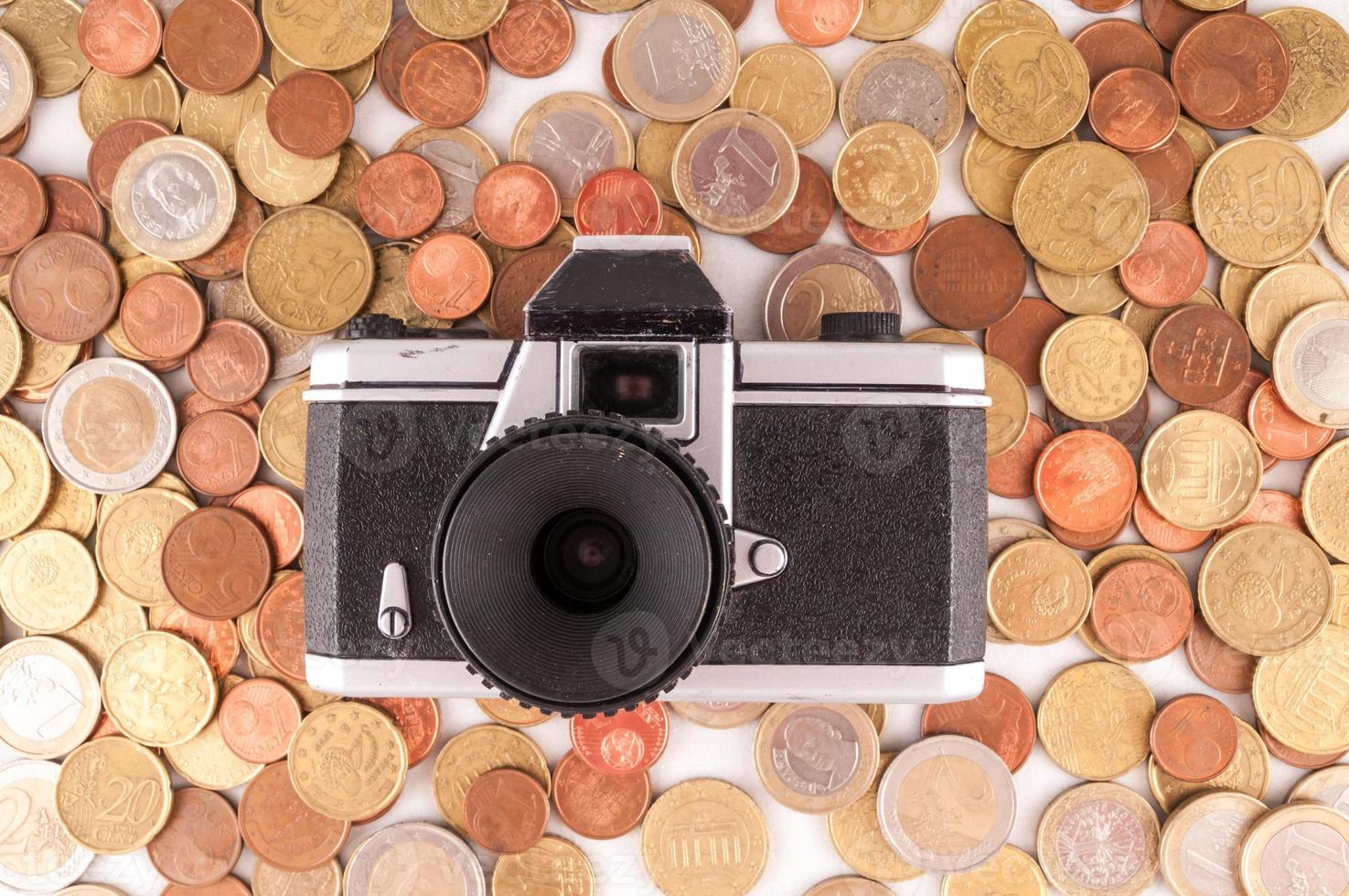 Câmera e moedas foto
