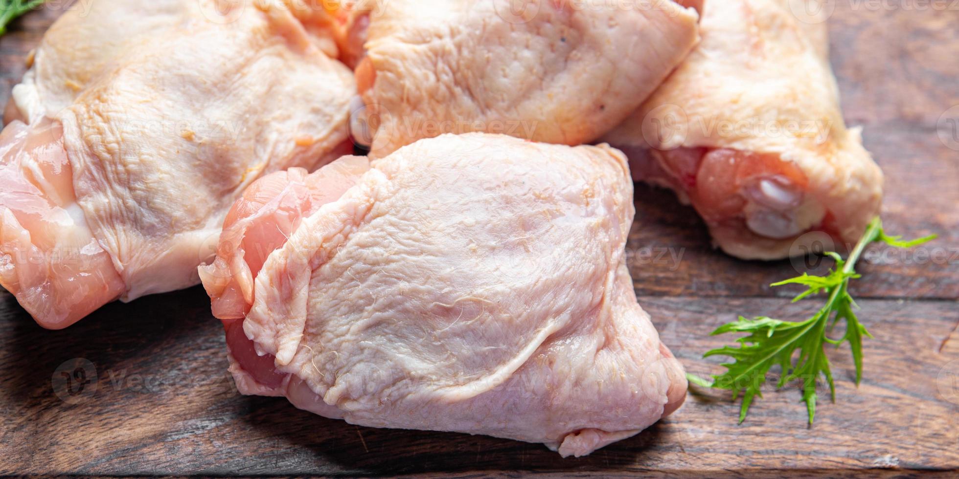 cru frango coxa frango pernas carne refeição Comida lanche em a mesa cópia de espaço Comida fundo rústico topo Visão foto