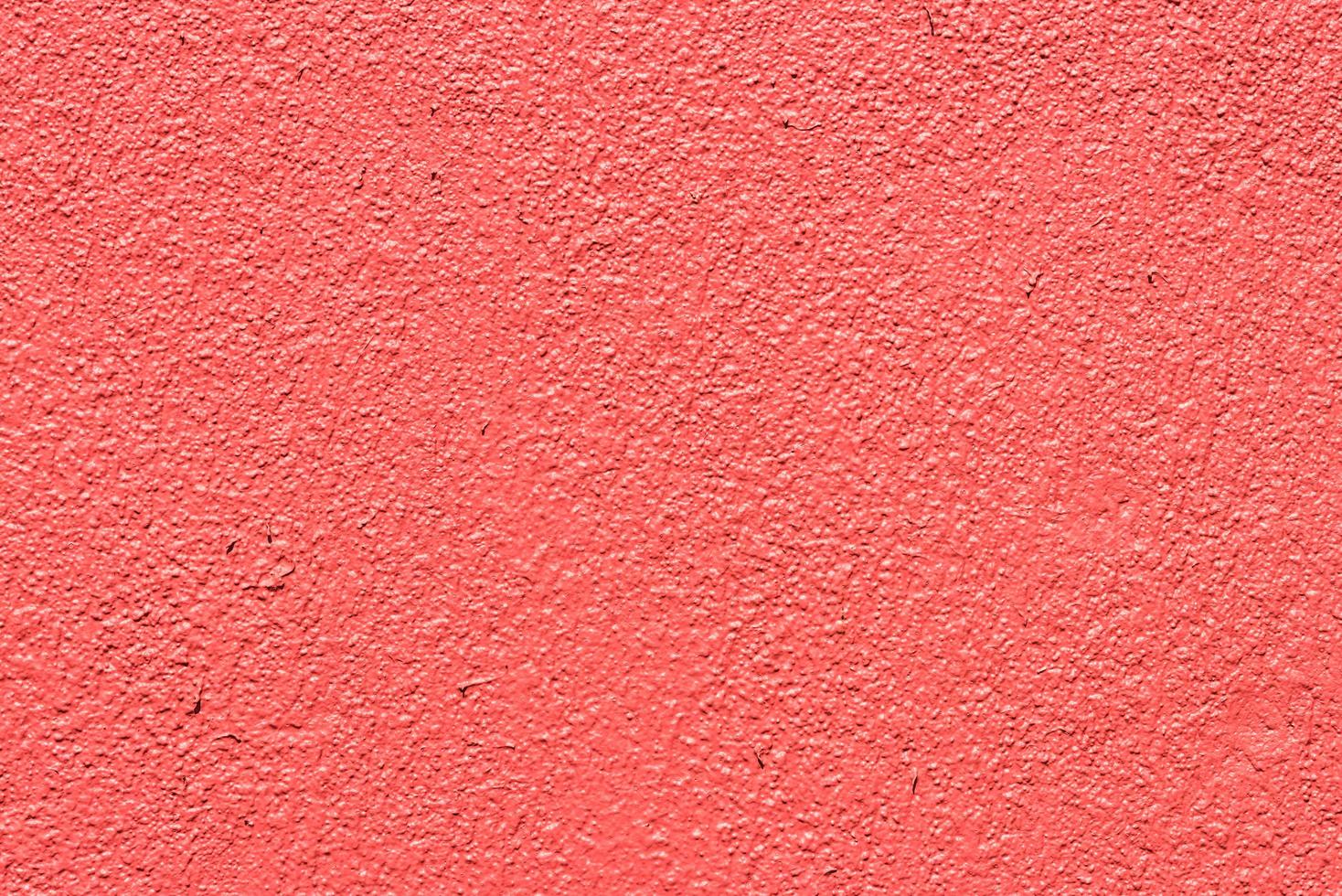 fundo de parede de concreto rosa e vermelho foto