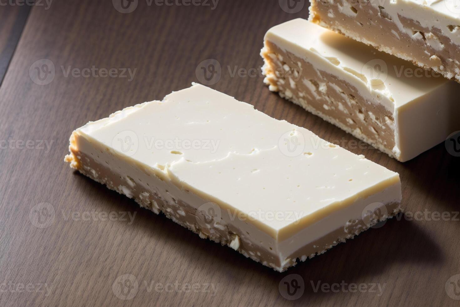 fechar acima do uma chocolate nougat em uma de madeira mesa. generativo ai foto