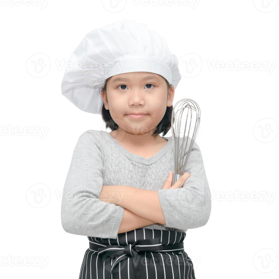 feliz ásia menina chefe de cozinha segurando cozinhando utensílios foto