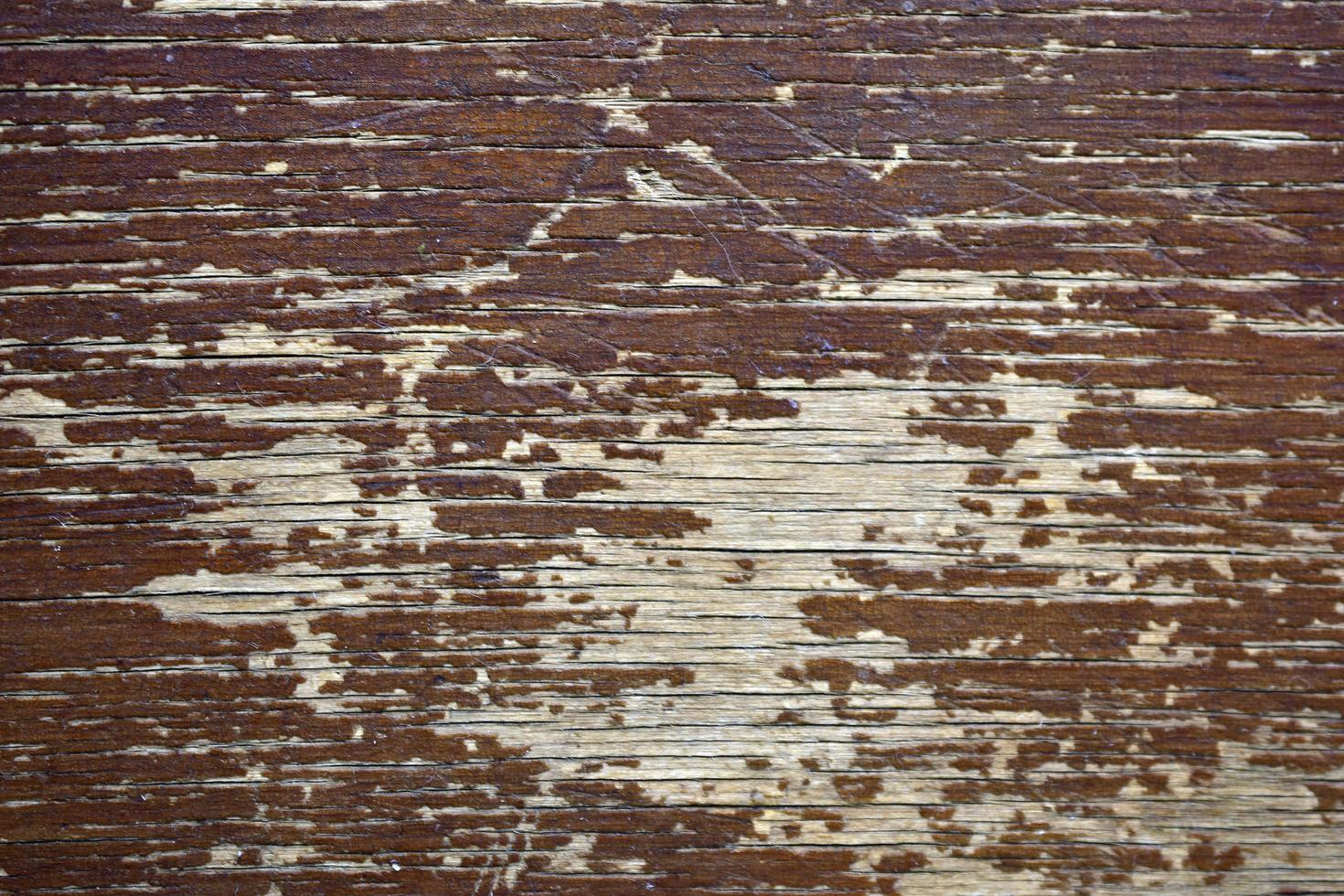 superfície de madeira velha com rachaduras e pintura foto