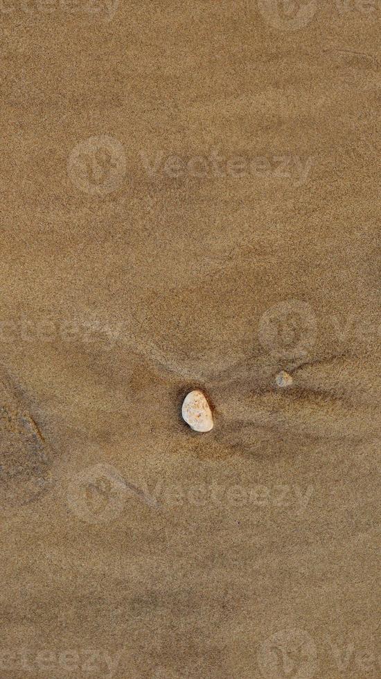 de praia areia pilha com pedras para fundo e textura foto