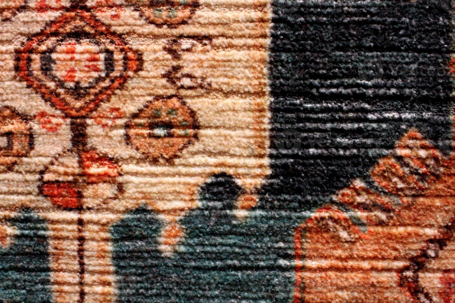 fechar acima detalhe do uma colorida persa tapete foto