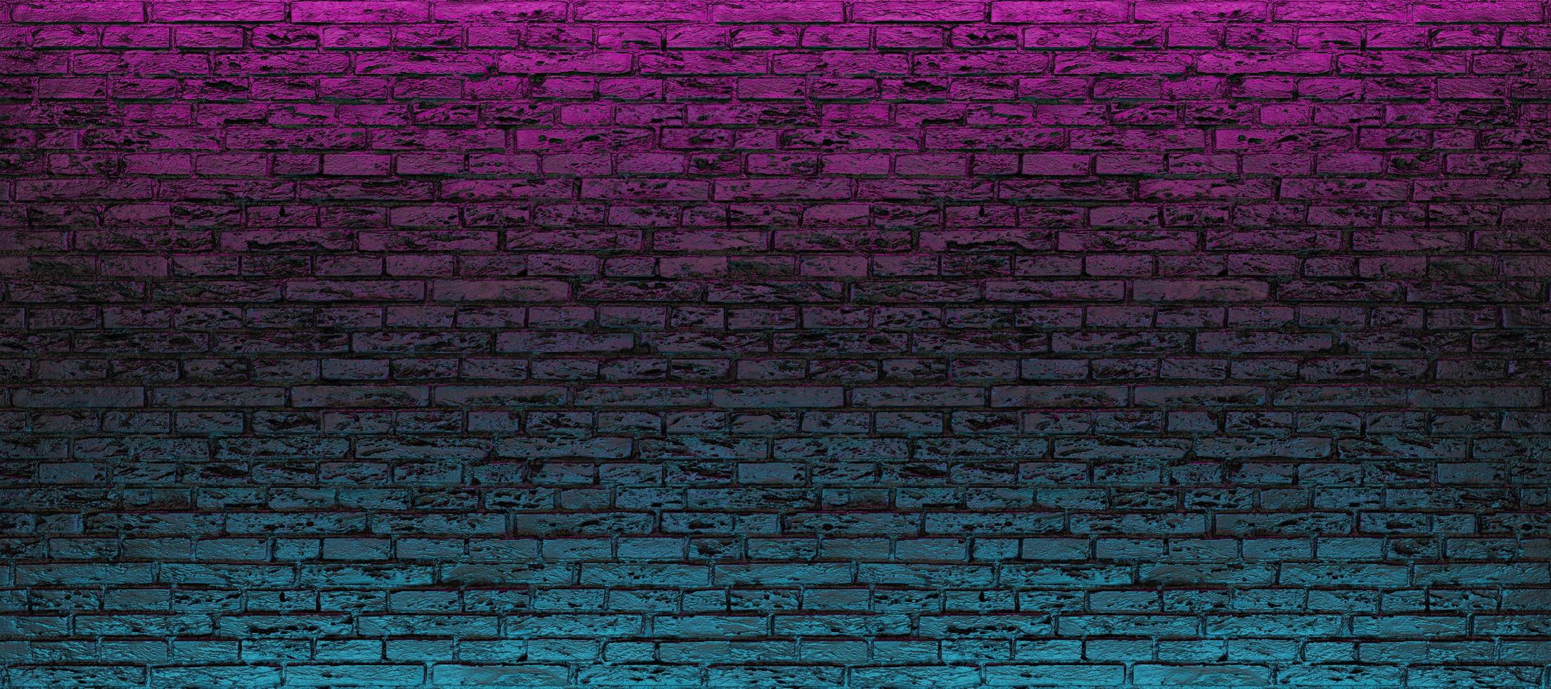 parede de tijolos vazia com luz neon azul e rosa foto