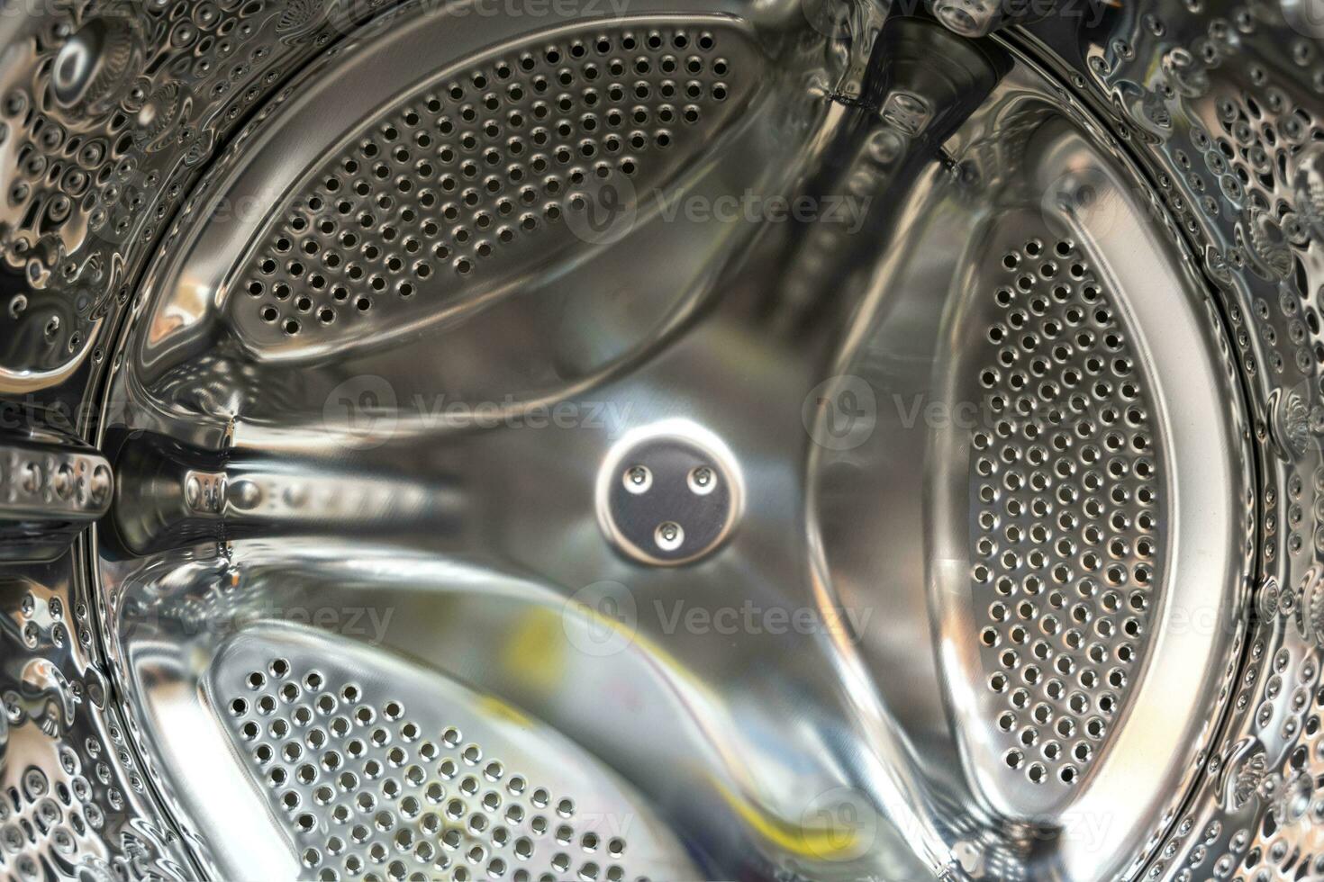 brilhante tambor do a frente lavando máquina dentro, família eletrodomésticos foto