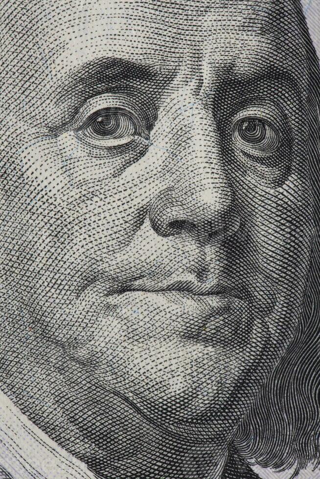 extremo macro do 100 dólar conta com benjamin Franklin retrato foto