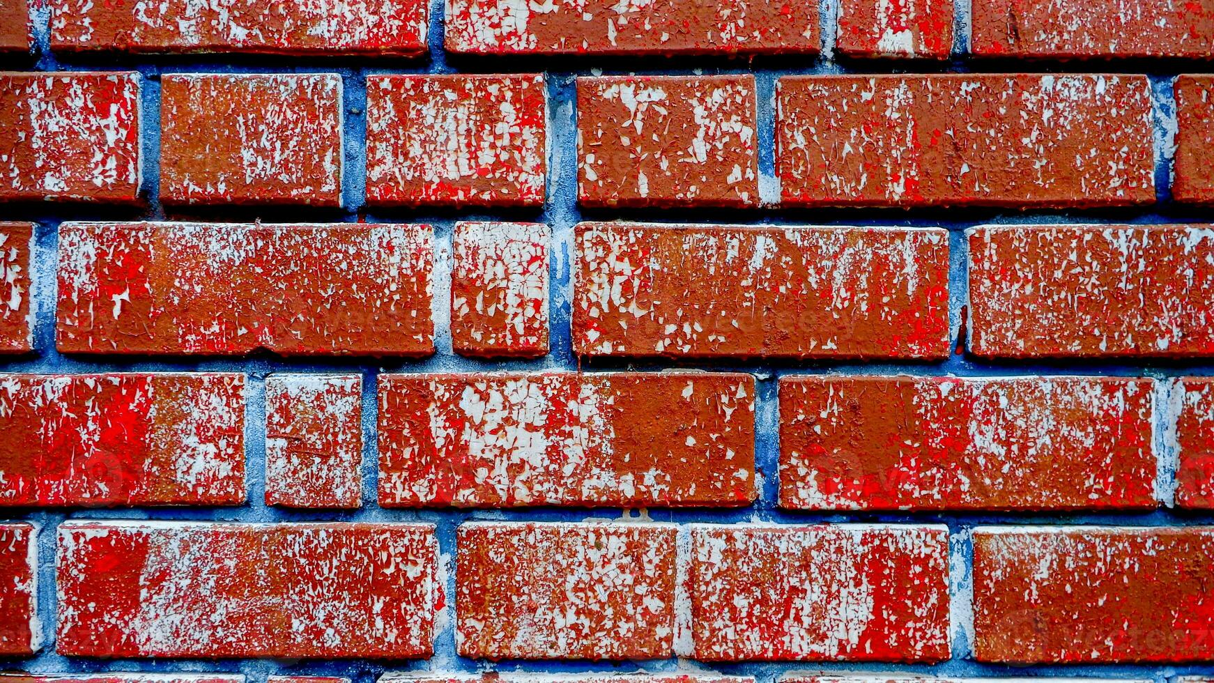 gasto vermelho tijolo parede fundo foto