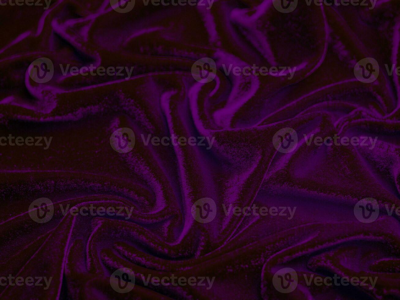 textura de tecido de veludo roxo usada como plano de fundo. fundo de tecido roxo vazio de material têxtil macio e liso. há espaço para o texto. foto